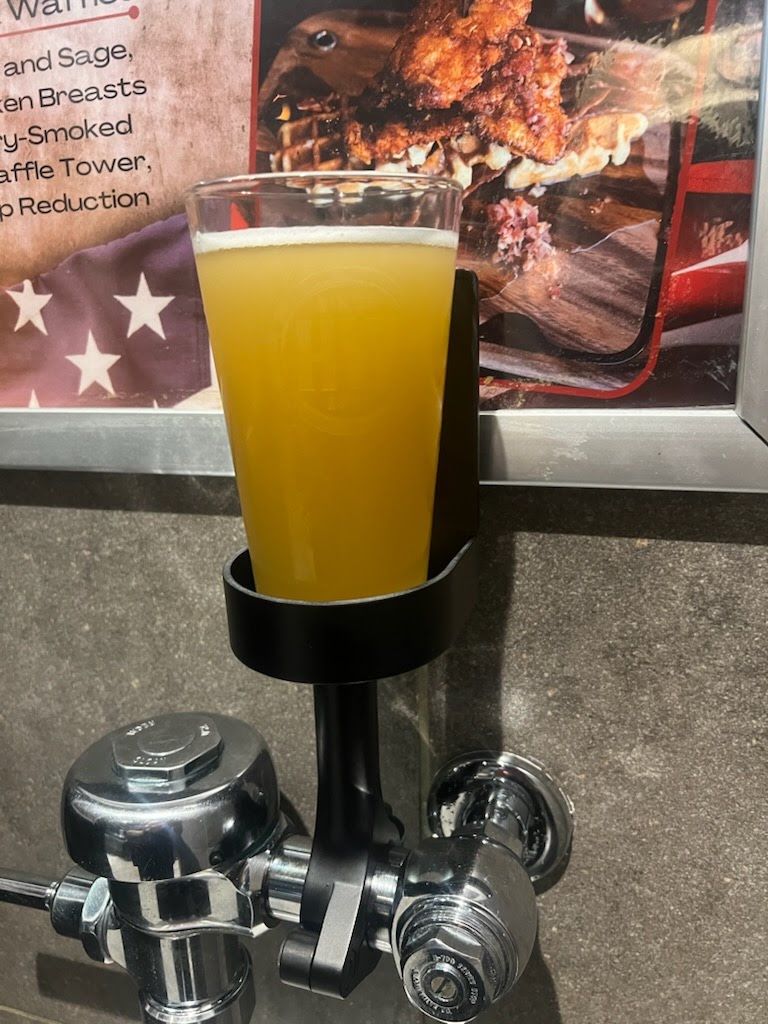 DrinkTight with a drink in a bar restroom